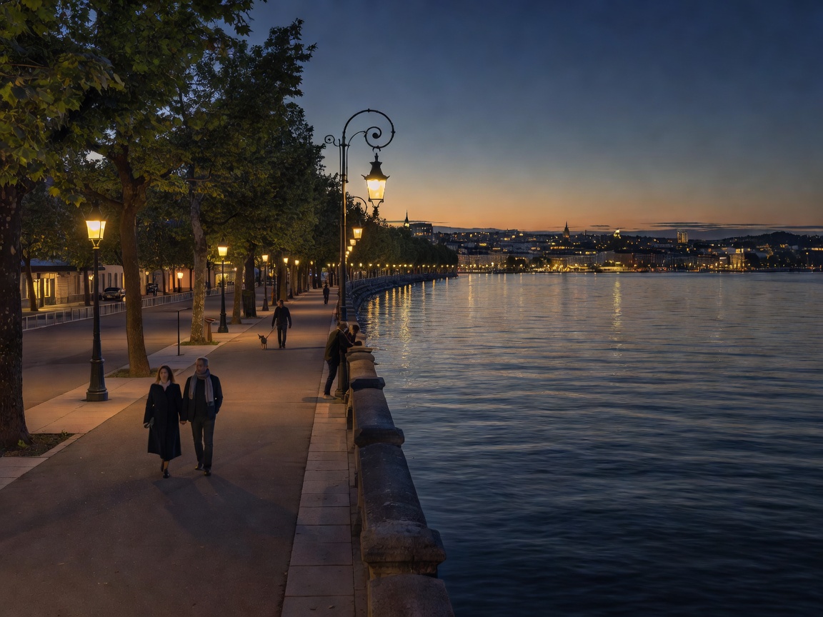 Lake Geneva shoreline promenade with illuminated evening lights